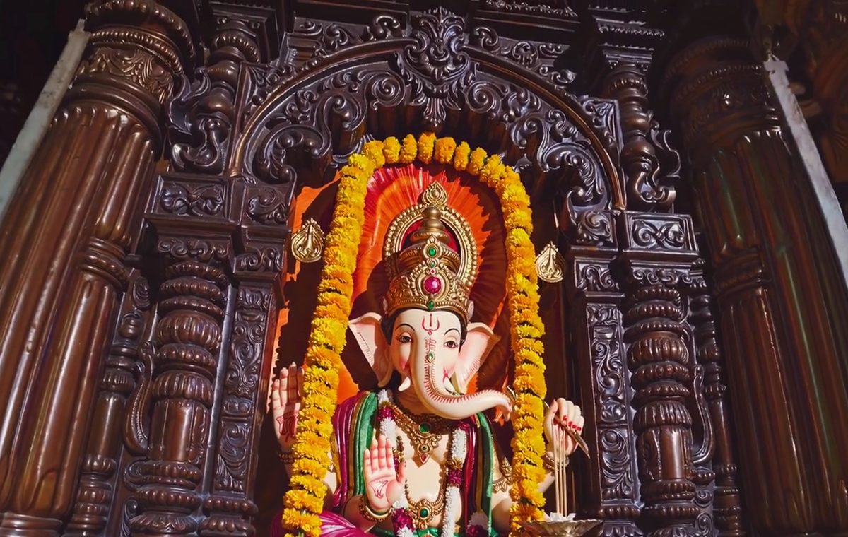 Deity darshan with marigold garlands